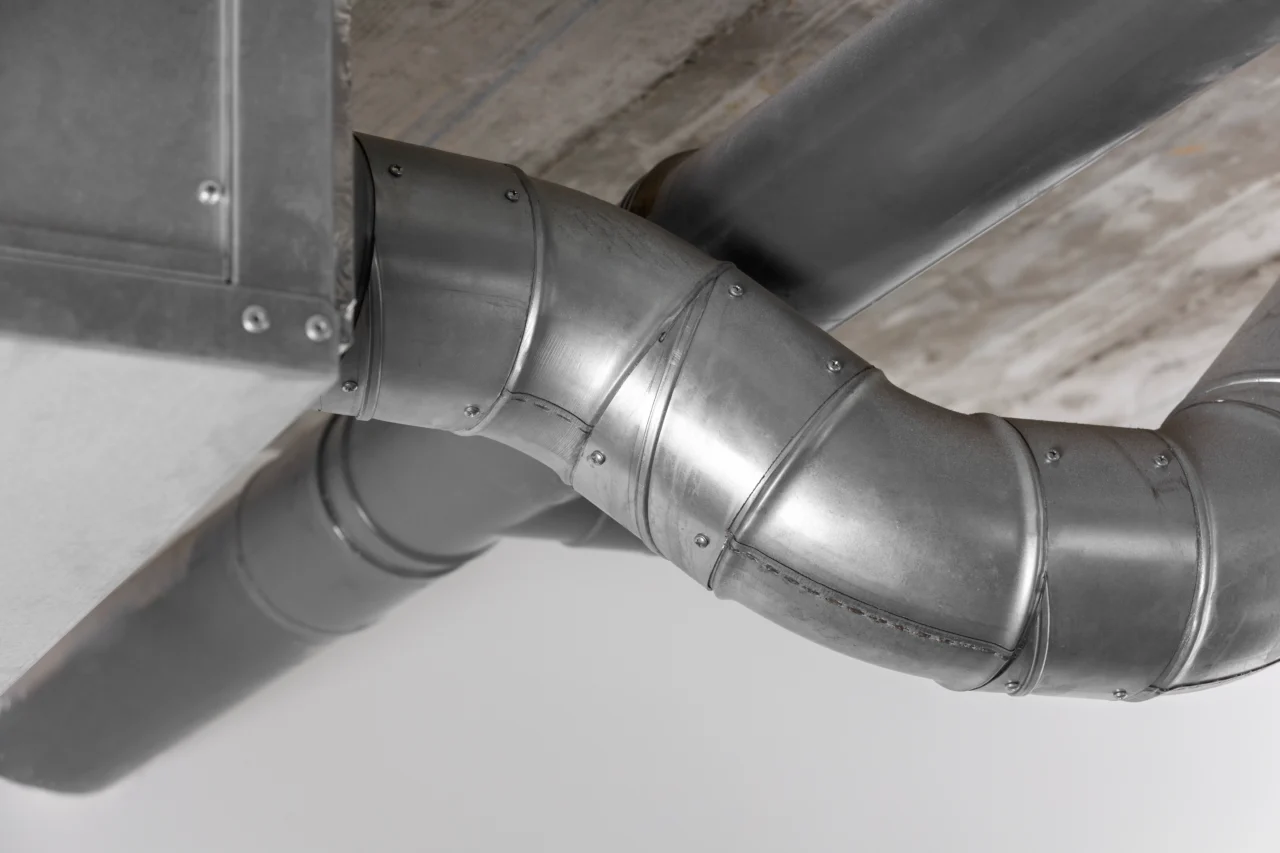 Dryer vent roof flashing installation detail - Step-by-step flashing sequence showing upper shingles over top of flashing and lower shingles beneath bottom flashing edge - Roof penetration