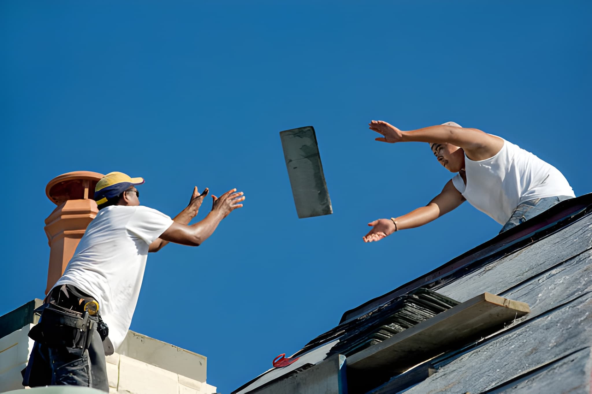 Roofing labor shortage 2026 impact on homeowners, frustrated homeowner on smartphone reviewing delayed contractor scheduling and high roofing quotes at kitchen table with calendar showing 6-week wait, contractor shortage 2026