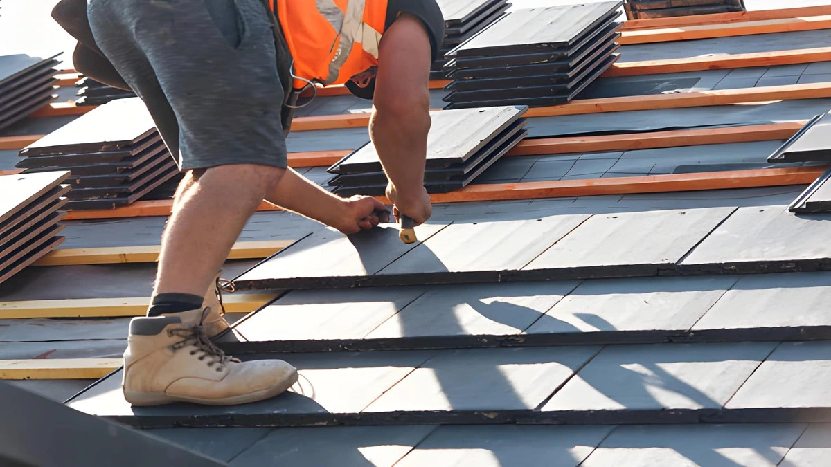 Slate roof repair nail sickness, side by side comparison of severely corroded original iron cut nail from historic slate installation next to new copper ring-shank slate nail showing correct replacement fastener, how to repair a slate roof
