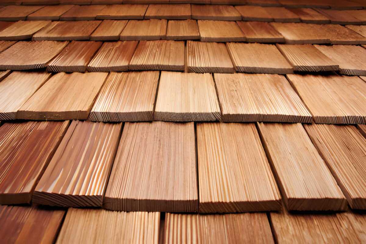 A luxury home featuring a high-quality cedar shake roof installation