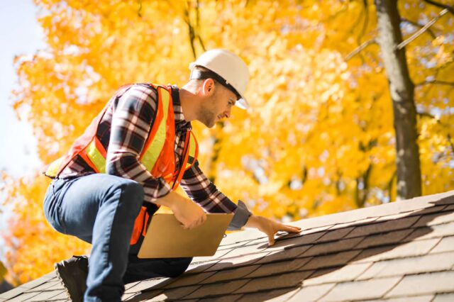 Professional conducting roof inspection to assess maintenance needs