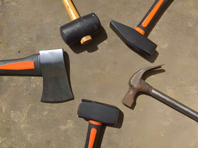 Collection of different roofing hammers including magnetic, hatchet, and estwing styles side by side